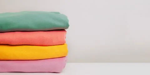 A stack of clothes. Clothes Donation, Renewable Concept. Preparing Garment at Stock Photos