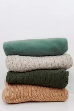 A stack of clothes. Clothes Donation, Renewable Concept.Preparing Garment at Stock Photos