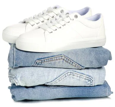 Stack of clothes jeans with white sneakers Stock Photos