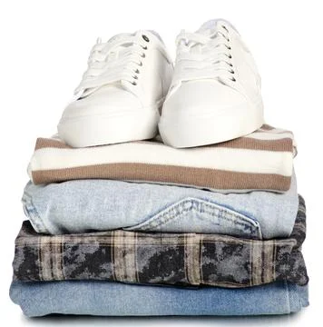Stack of clothes jeans with white sneakers Stock Photos