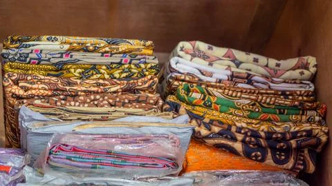 Stack of clothes in wardrobe. stack of colorful folded clothing items. Stock Photos