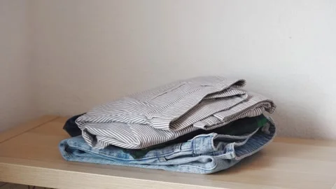 Stack clothing for sorting to recycling or baggage packing. Stock Footage 285058702