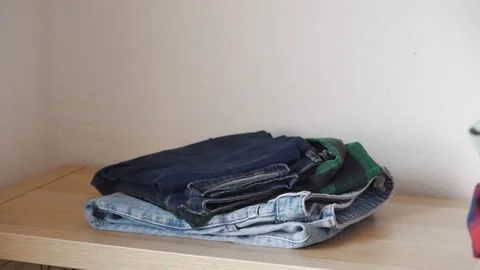 Stack clothing for sorting to recycling or baggage packing. Stock Footage 285058799