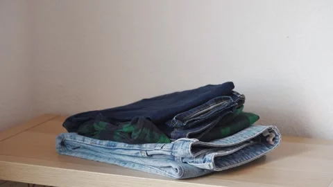 Stack clothing for sorting to recycling or baggage packing. Stock Footage 285058938