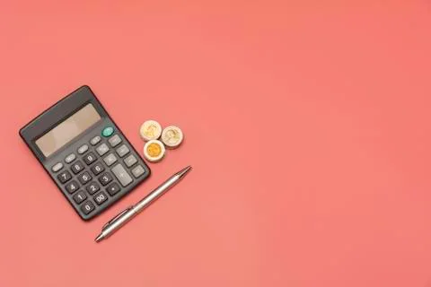 Stack of coin and calculator with copy space. Accounting and business concept Foto stock