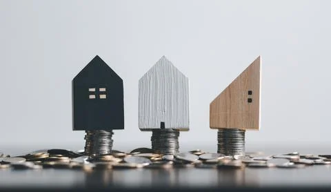 Stack coin on and home model for family put on top in office, Business inve.. Stock Photos