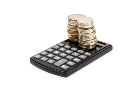 The stack of coin with calculator on white background, concept of calculating Foto stock