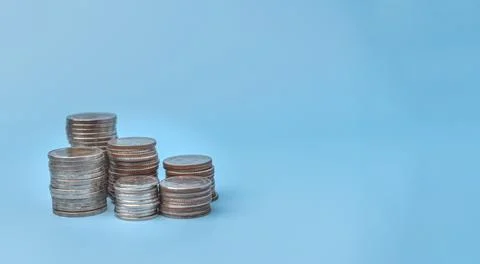Stack coin money on blue background concept finance growth economy Stock Photos