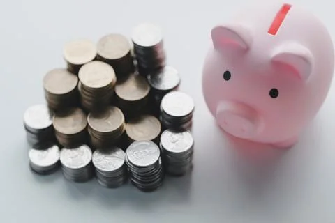 Stack coin with pig saving. a pile of coins, business, investment, finance,.. Foto stock