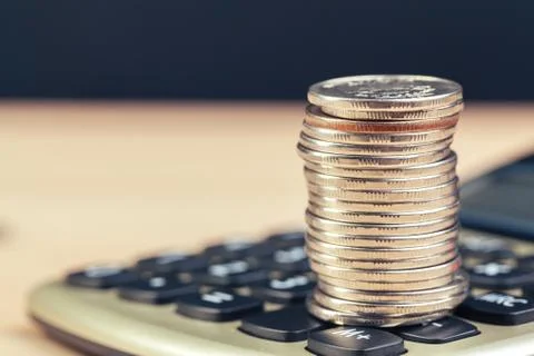 Stack of coins and calculator,concept idea for business finance Foto stock