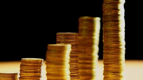 Stack of coins and the dollar on a black background, the concept of the ruble's Stock-Footage 334027618