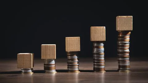 Stack of coins and empty wooden cubes on the table. Business. Finance 스톡 사진