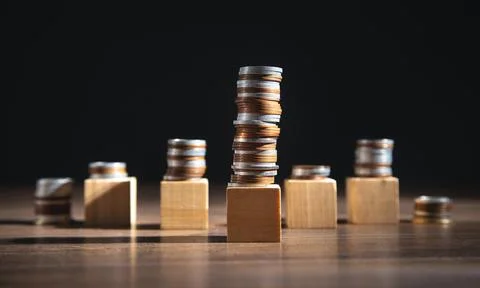 Stack of coins and empty wooden cubes on the table. Business. Finance Stockfoto's