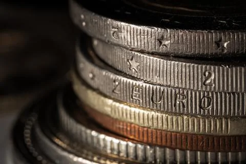 Stack of the coins and Two euro coin edge with soft focus Stock Photos