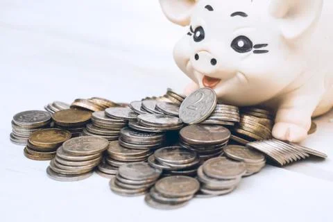 A stack of coins on the background. Stock Photos
