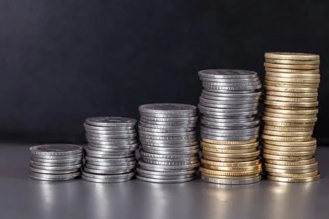 Stack of Coins on Black Background Stock Photos