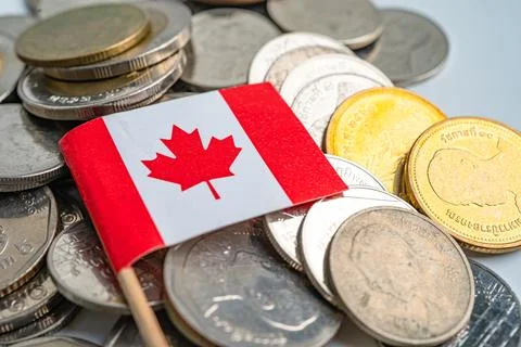 Stack of coins with Canada flag on white background. Stock Photos
