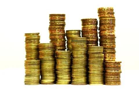 Stack of coins in close up over white Stock Photos