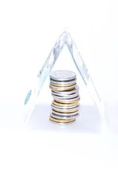 Stack of coins covered banknot Stock Photos