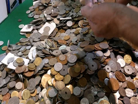 A stack of coins. Different world currencies. Stock Footage 81530354
