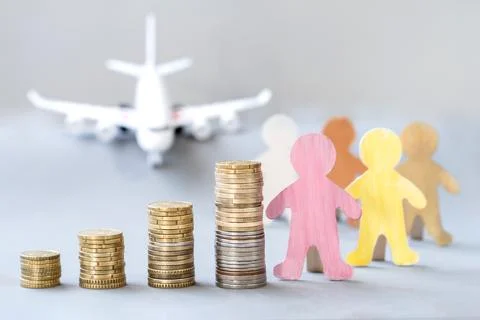 Stack of coins, group of people waiting in line for a plane. Life insurance. Fotos de archivo