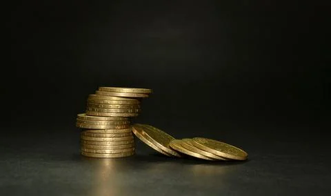 Stack of coins isolated on black background Foto stock