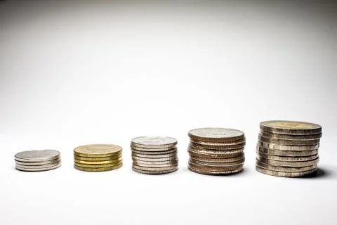 Stack of coins with the king on a coin. Stock Photos