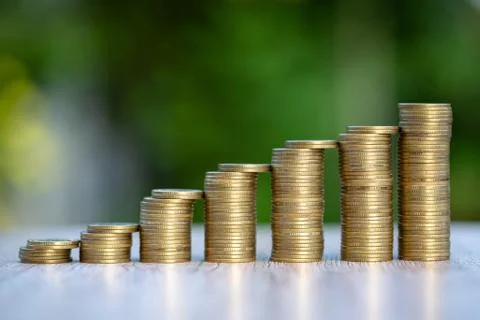 Stack coins from low to high nature background. Business investment concept.  Stock Photos