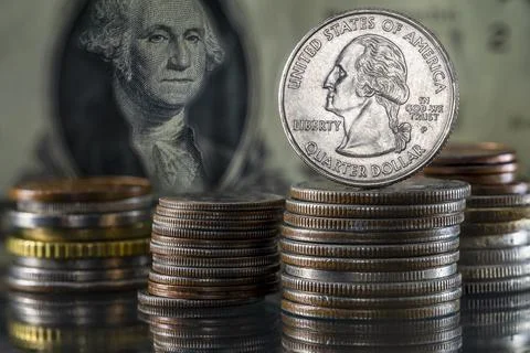 Stack of Coins Quarter Dollar on top George Washington Overlooking from Dolla Stock Photos