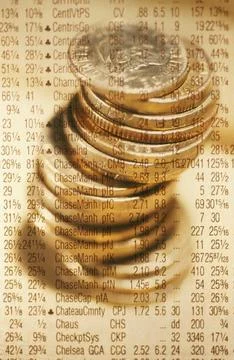 Stack of coins on stock market data Stockfoto's