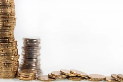 Stack of coins on white background. Stock Photos