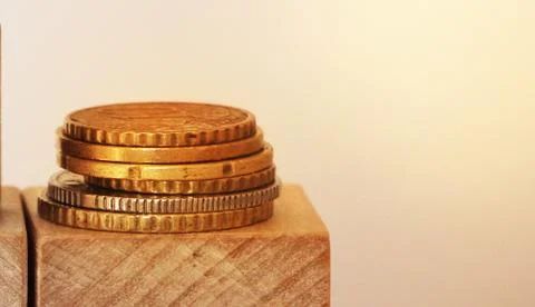 Stack of coins on wooden cubes with copyspace. Financial concept 스톡 사진