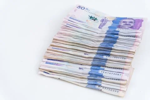 Stack of Colombian 50.000 Peso Banknotes on White Background, Top View Stock Photos