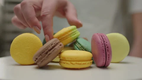 Stack of color merengue macaron cookies rotating on the plate. Close up of Stock Footage 170452766
