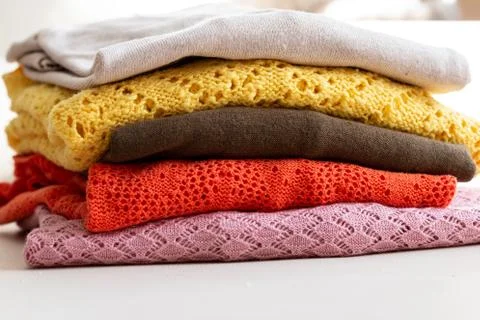 Stack of colored and textured sweaters Stock Photos