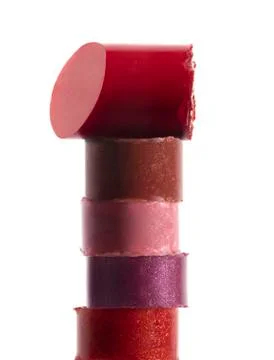 Stack of colored broken lipsticks on white Stock Photos