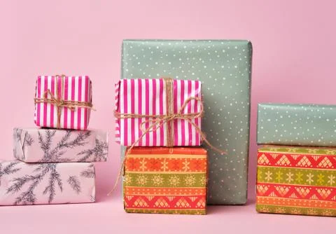 Stack of colored paper wrapped gift boxes Stock Photos