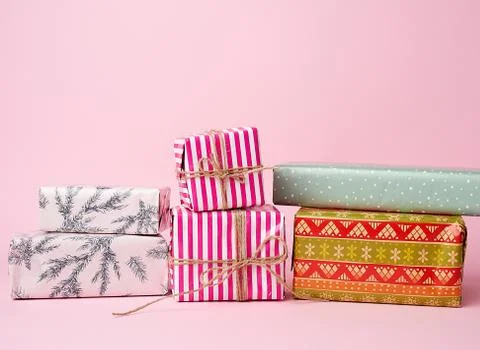 Stack of colored paper wrapped gift boxes. great design for any purposes. Stockfoto's