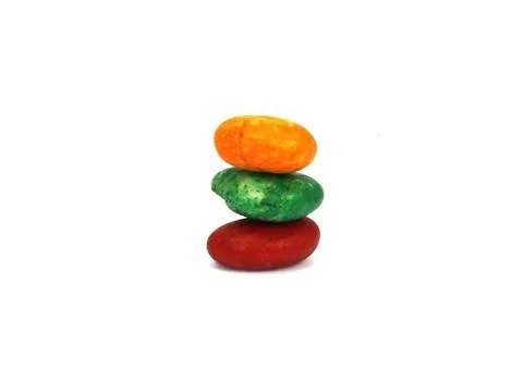 Stack of colored pebble stones on white background Stock Photos
