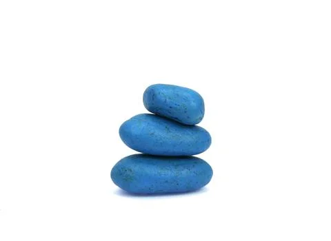 Stack of colored pebble stones on white background Stock Photos