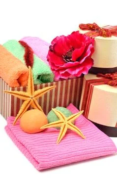 Stack of colored towels in the gift boxes with  starfishes Stock Photos