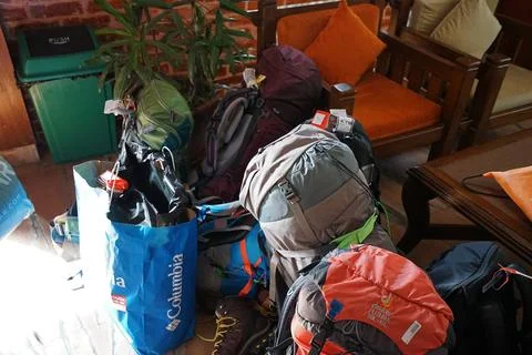 Stack of colorful backpacks and stuff on the ground Stock-Fotos