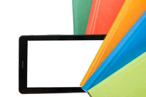 Stack of colorful books and electronic book reader. Electronic library concept Stock Photos