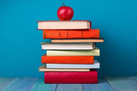 Stack of colorful books, grungy blue background, free copy space Stock Photos