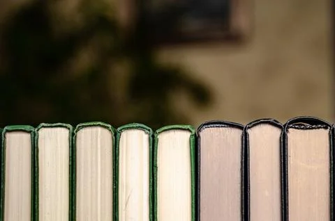 Stack of colorful books in a library Stock Photos