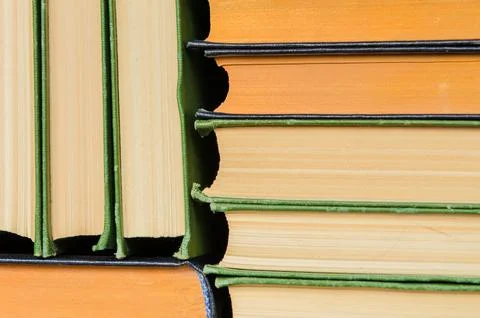 A stack of colorful books in a library Stock Photos