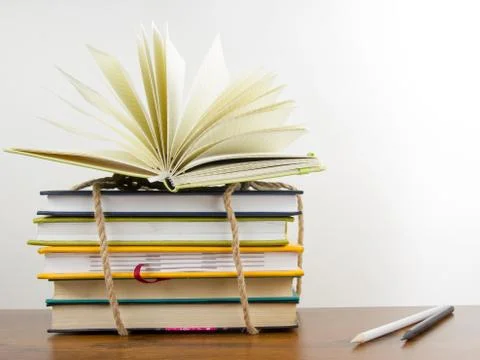 A stack of colorful books, open book Stock Photos