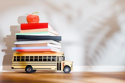 Stack of colorful books with red apple on top Stock Illustration