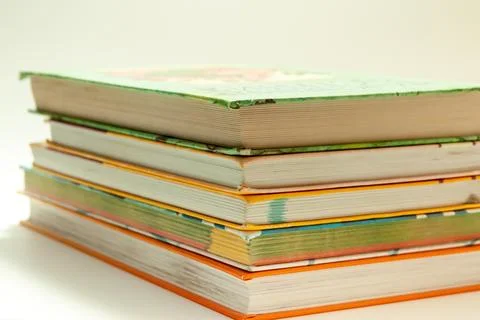 Stack of colorful books on white background Stock Photos