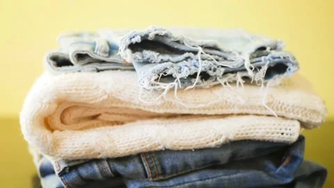 Stack of colorful clothes stop motion. Shopping concept. Stock Footage 138647575